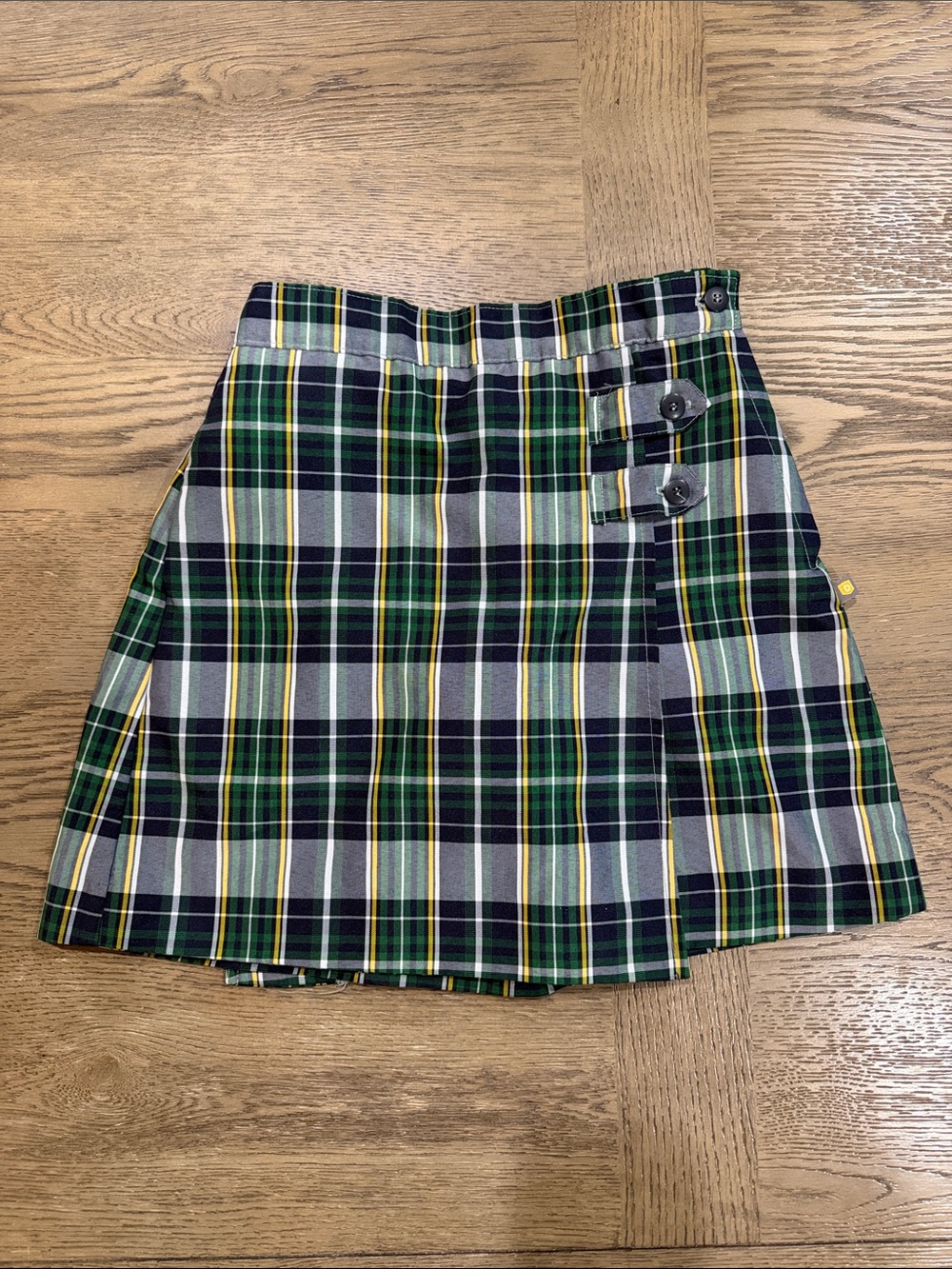 Girls' Dennis Uniform Green & Navy Plaid Pleated Skort with Side Button Tabs